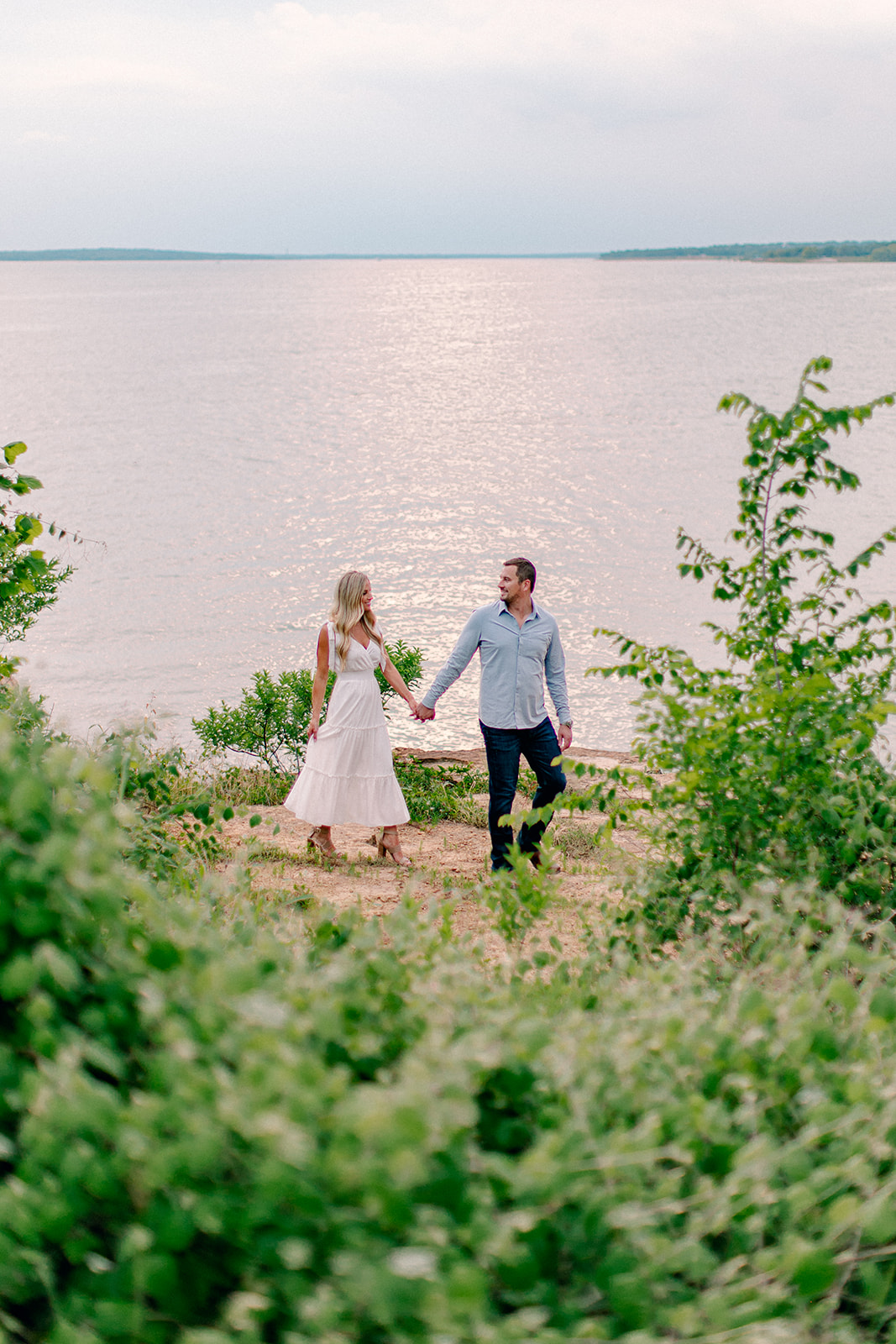 walking along the beach during engagement session