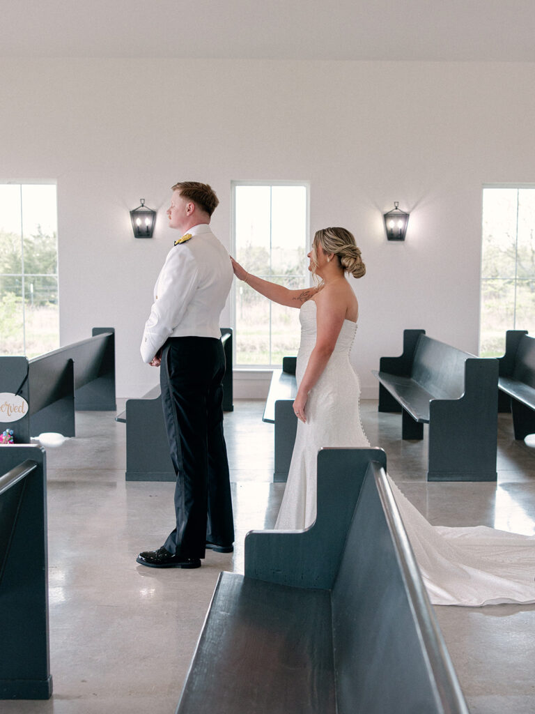 first look with bride and groom at the indoor chapel for their wedding at Davis & Grey Farms