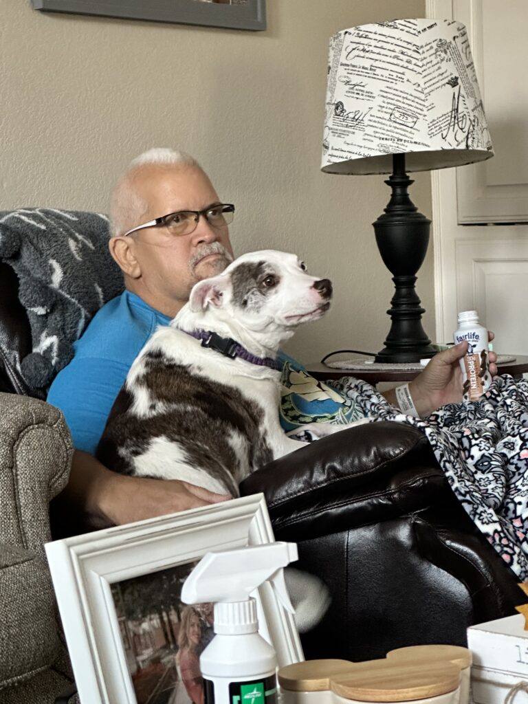 man and dog on chair